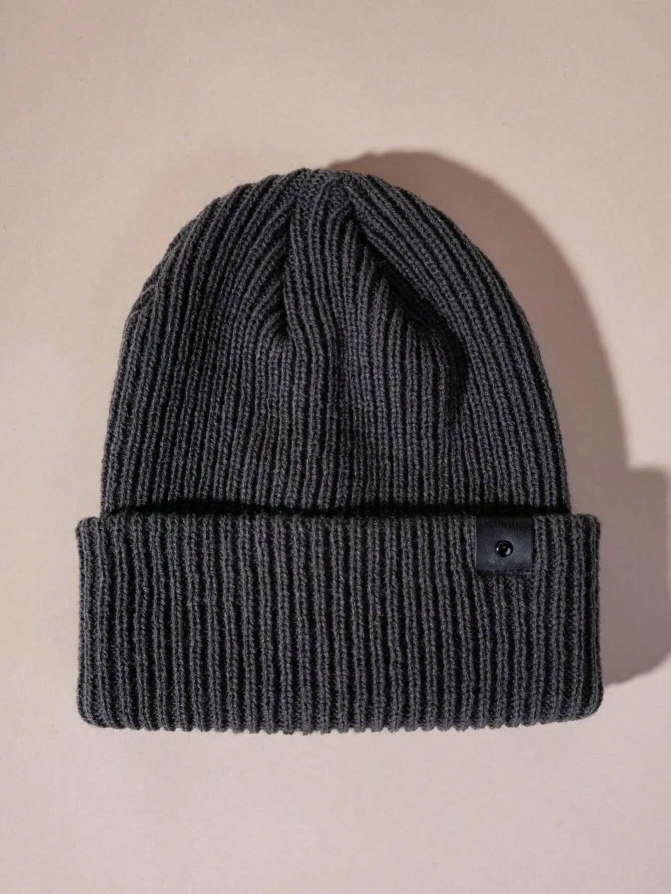 Simple knitted hat with leather buckle