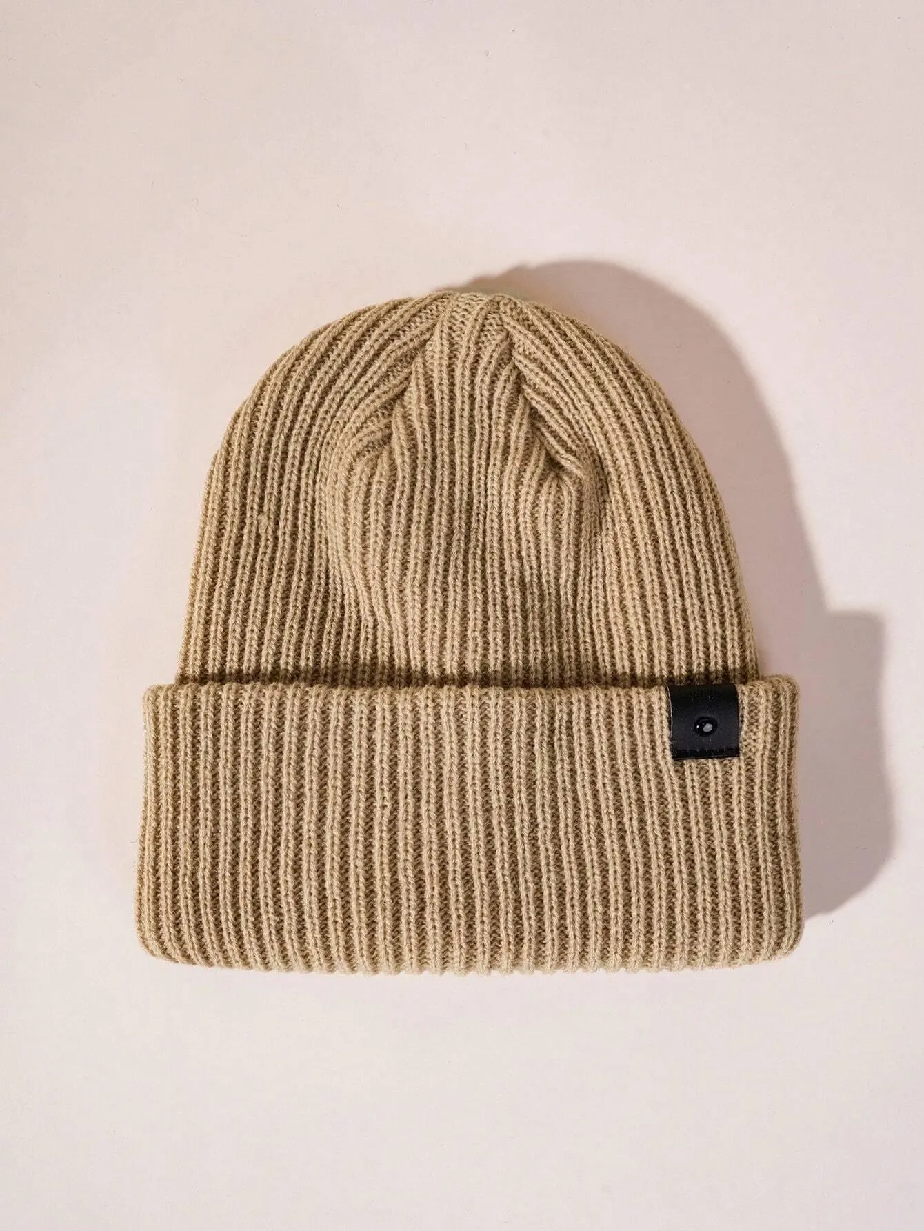 Simple knitted hat with leather buckle