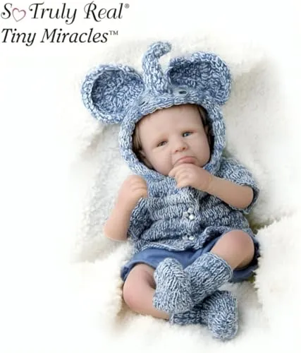 The Ashton-Drake Galleries Tiny Miracles Evie's Elephant Ears Baby Girl Collectible Doll So Truly Real Lifelike Doll with Giggling Feature & Adorable Elephant Sock Outfit by Sherry Rawn 10-Inches